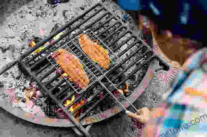 A Close Up Of A Simple Meal Cooked Over A Campfire In The Outback, Consisting Of Grilled Fish, Vegetables, And Damper Bread. DIGGER: One Man One Pan And A Million Square Miles Of Outback